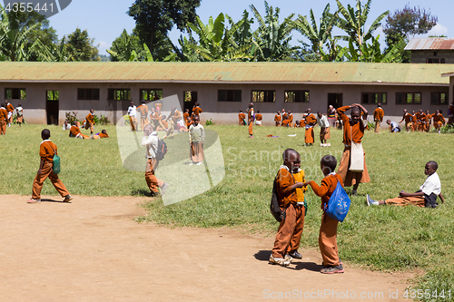 Image of Children in uniforms playing in the cortyard of primary school in rural area near Arusha, Tanzania, Africa.