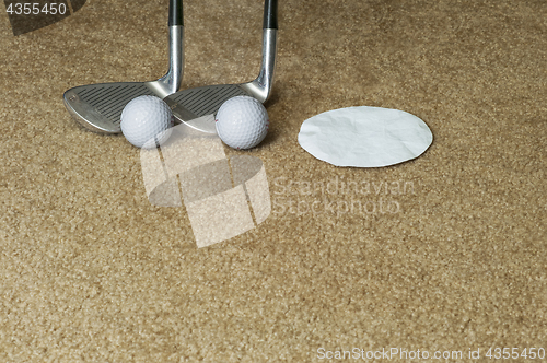 Image of Golf Clubs Golf Balls Hole On A Rug