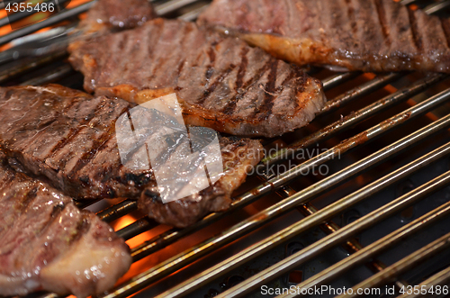 Image of Beef steaks on the grill 