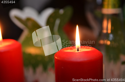 Image of Christmas candle burning at night.