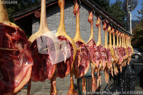 Image of The meat drying outside on the sun