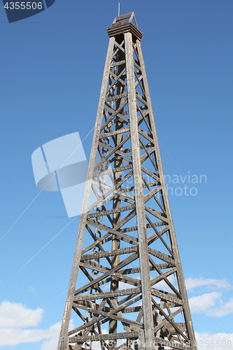 Image of Old wooden oil rig.