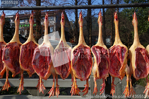 Image of The meat drying outside on the sun