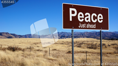 Image of Peace brown road sign