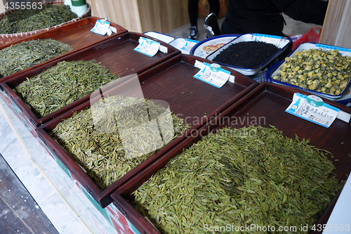 Image of Various types of tea in wooden bowls
