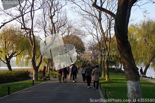 Image of People walk around the beautiful scenic area in West lake in Han