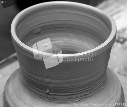 Image of Process of making clay vase on pottery wheel