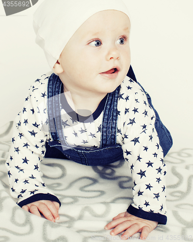 Image of little cute baby toddler on carpet isolated close up smiling ado