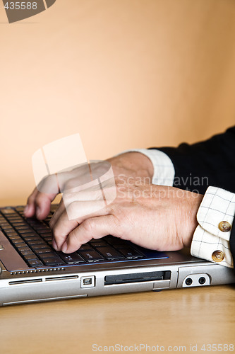 Image of Working senior businessman