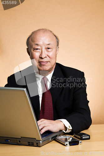 Image of Working mature businessman