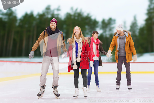 Image of friends holding hands on outdoor skating rink