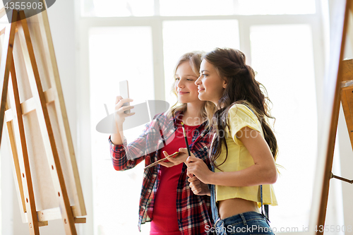 Image of artist girls taking selfie at art studio or school