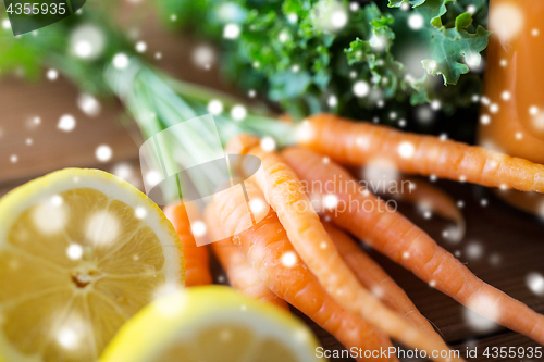 Image of close up of carrot, lemon and lettuce