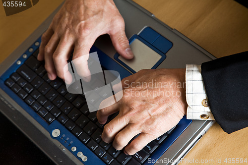 Image of Working mature businessman