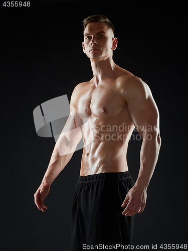 Image of young man or bodybuilder with bare torso