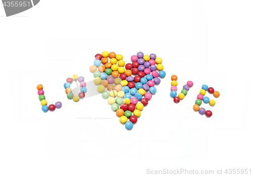 Image of Word ''Love'' and abstract heart from bright colorful candy