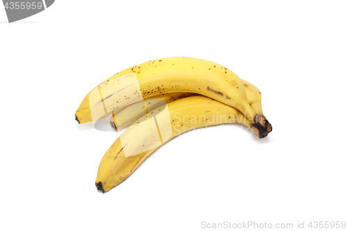 Image of Ripe yellow bananas on white background