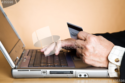 Image of Senior businessman buying online
