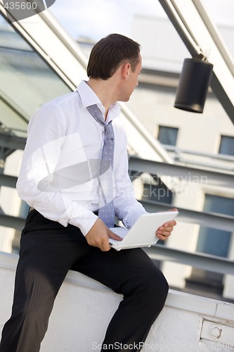 Image of businessman with white laptop computer