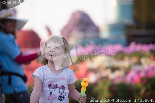 Image of little girl with a doll