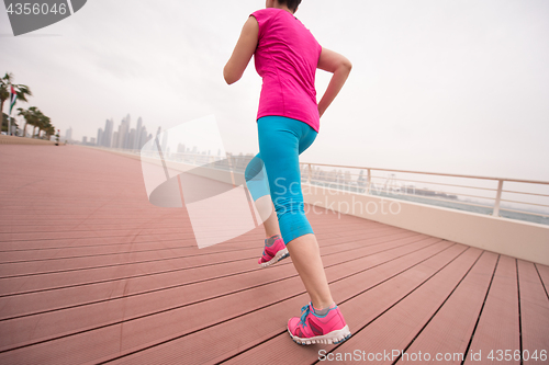 Image of woman running on the promenade