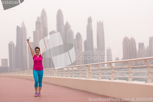 Image of young woman celebrating a successful training run