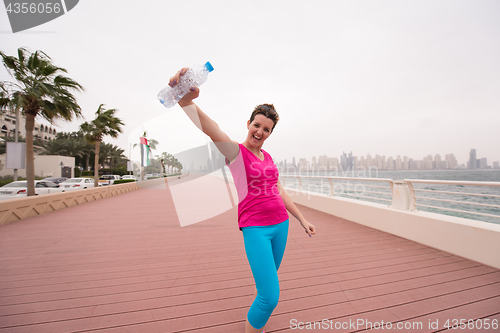 Image of young woman celebrating a successful training run