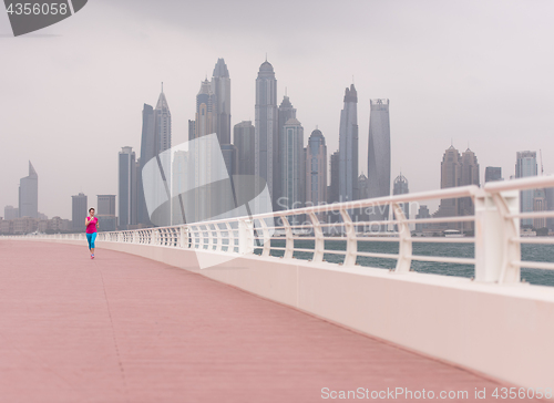 Image of woman running on the promenade