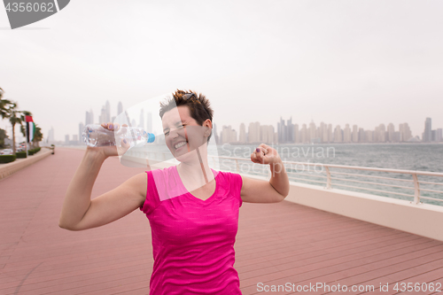 Image of young woman celebrating a successful training run