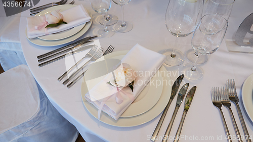Image of Spring table settings with fresh flower, napkin and silverware. Holidays background. Selective Focus.