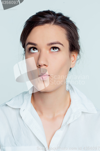 Image of The young woman\'s portrait with thoughtful emotions