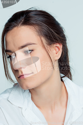 Image of The young woman\'s portrait with thoughtful emotions