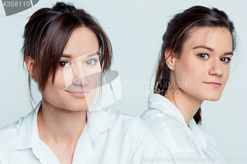 Image of Studio portrait of female twins