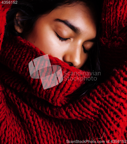Image of young pretty indian mulatto girl in red sweater posing emotional, fashion hipster teenage, lifestyle people concept closeup