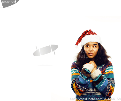 Image of young pretty african american girl in red christmas hat isolated