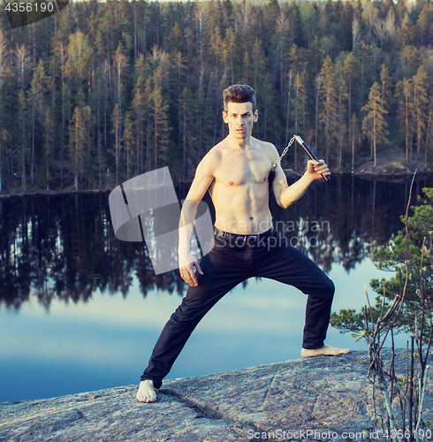 Image of middle age man doing sport yoga on the top of the mountain, lifestyle people outdoor, summer wild nature for training 