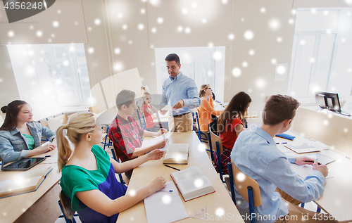 Image of group of students and teacher with test results