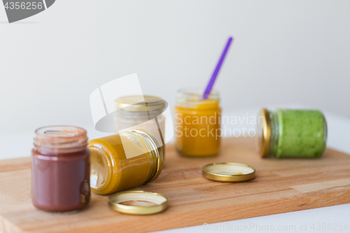 Image of vegetable or fruit puree or baby food in jars