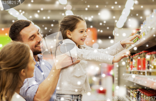 Image of happy family buying food at grocery store