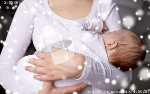 Image of close up of mother holding newborn baby