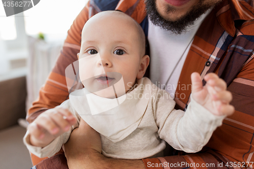 Image of close up of happy little baby boy with father