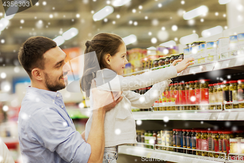 Image of father with child buying food at grocery store
