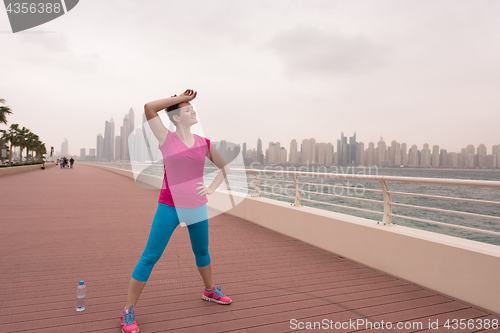 Image of woman stretching and warming up