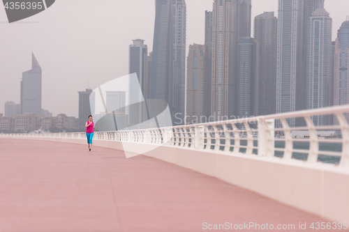 Image of woman running on the promenade