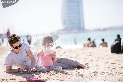 Image of Mom and daughter on the beach