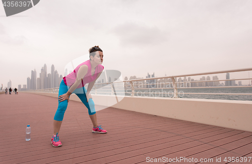 Image of woman stretching and warming up