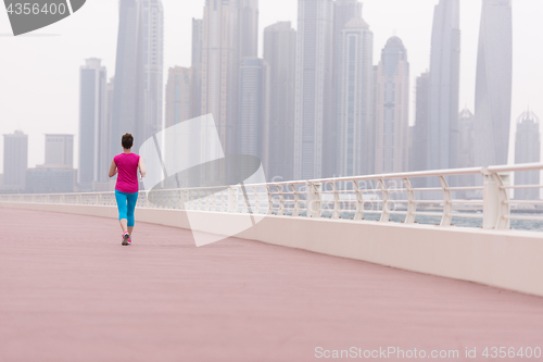 Image of woman running on the promenade