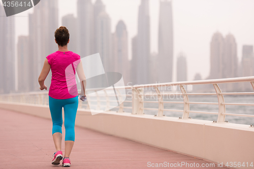 Image of young woman celebrating a successful training run