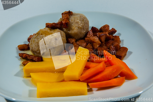 Image of Potato dumplings, traditional Norwegian food with accessories