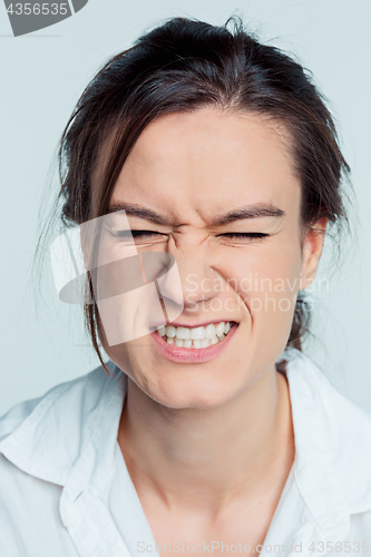 Image of Portrait of young brunette feeling stress